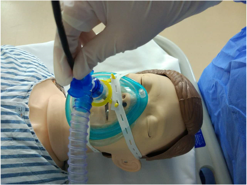 Bronchoscopy procedure simulation using medical mannequin with oxygen mask and bronchoscope insertion